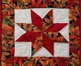 Absolutely gorgeous table mat using the diamond shapes in various autumn colors