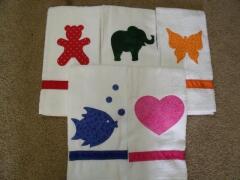 Kids hand towels.  Embellish with appliques and personalize with their names with embroidery or fabric markers.   Great idea for guest towels, holiday/seasonal towels as well. These were sewn by Carol Murphy 2009