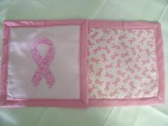 These are samples of the front & back of Breast Cancer potholders/hotpads designed by Carol Murphy, Sept. 2009; the Breast Cancer awareness ribbon applique & the coordinating cancer fabric is available on the website.