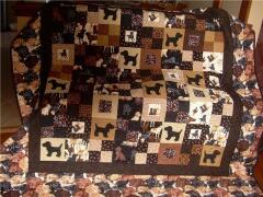 This beautiful puppy quilt was created by Brenda Chisholm 2009 - for her best friend who had recently lost her black lab. 