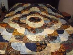 2015, April, Carol C. made this awesome quilt with our Cheyenne Silhouette in the center.- design is a drunkard's path variation.